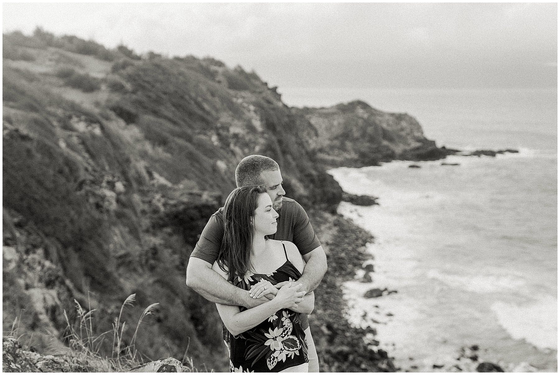 couple taking photos at maui lookout