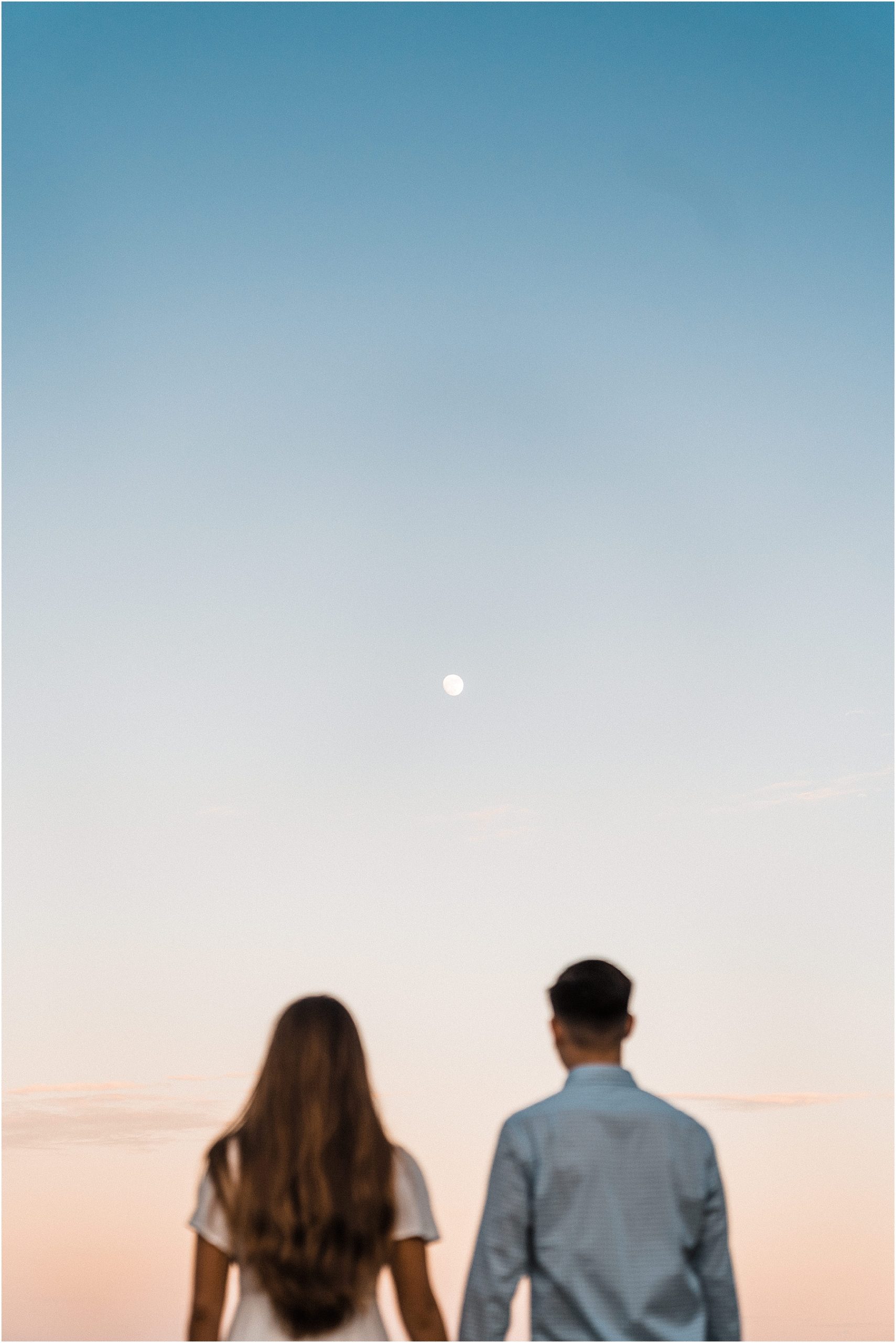 couple looking at the moon in hawaii