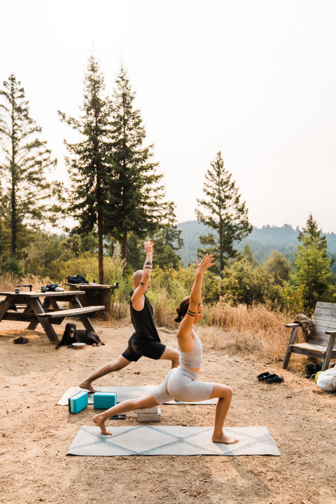 couple doing yoga in california