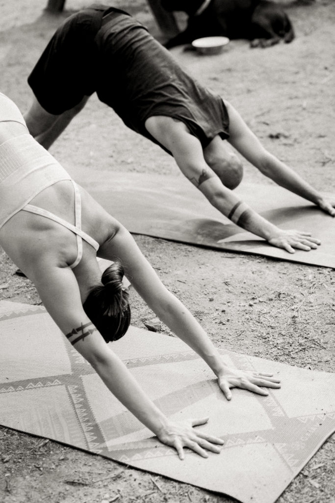 couple doing yoga before wedding