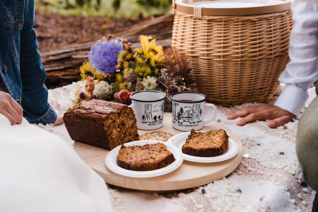 Sequoia national park wedding with elopement picnic with coffee, carrot cake, boho rattan picnic basket, and wildflower wedding bouquet