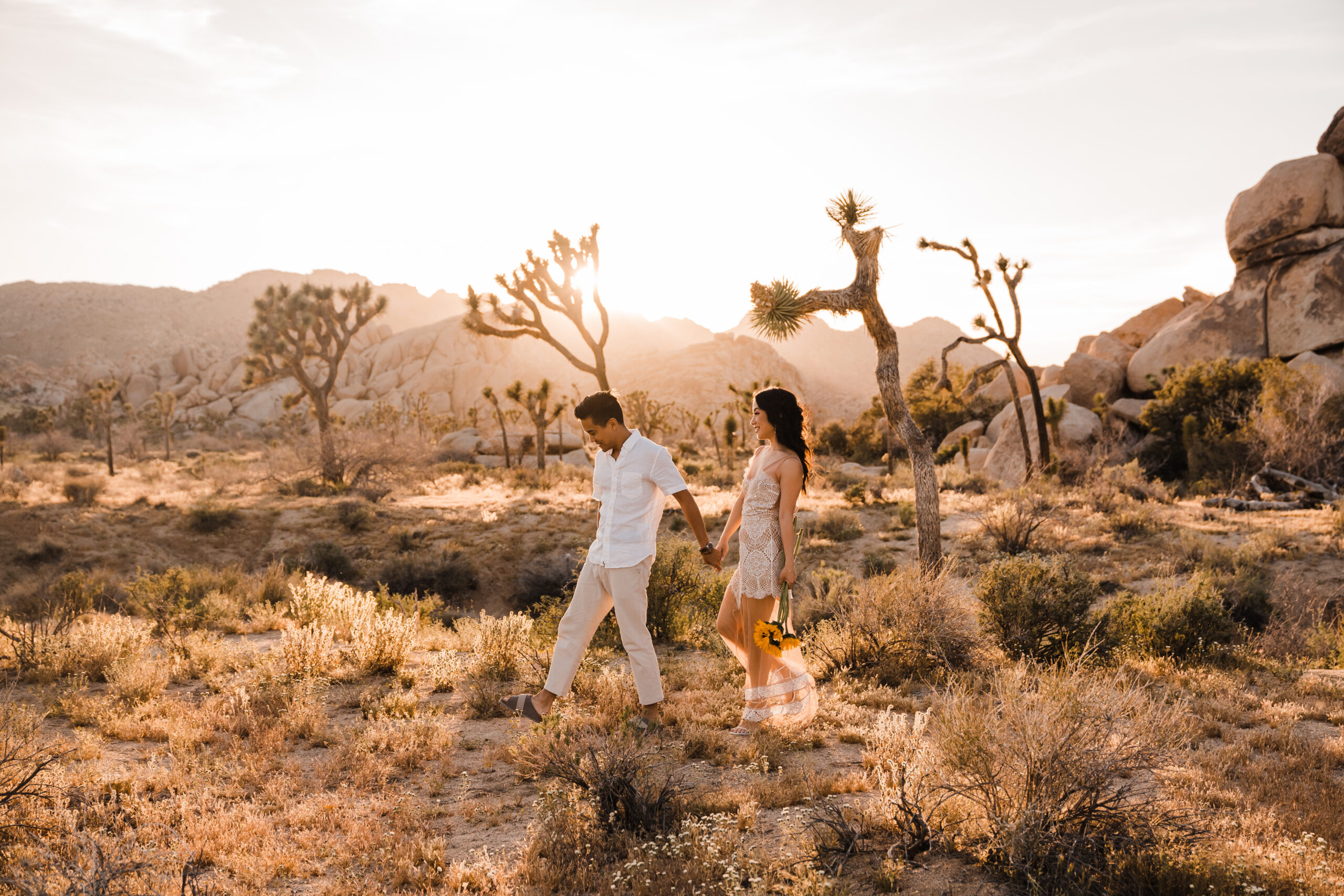 couple walking in joshua tree national park