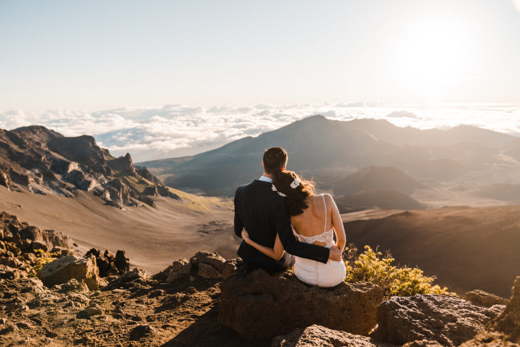 Maui elopement couple watching sunrise at Haleakala National Park in Hawaii 